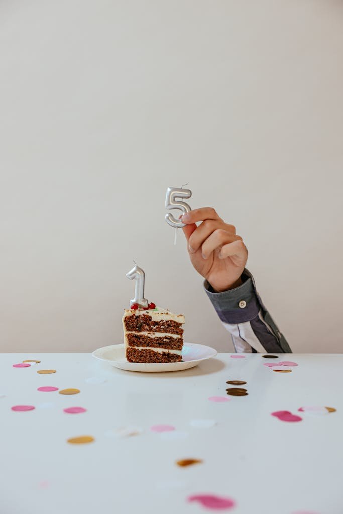 A slice of cake with '15' candles, perfect for birthdays or anniversaries.